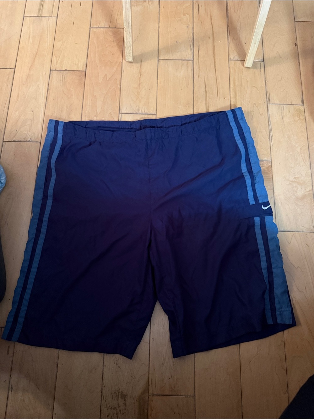 Nike Men's Dark Blue Athletic Shorts with Light Blue Side Stripes